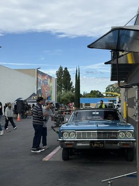 Front view of a classic car near the mural site.