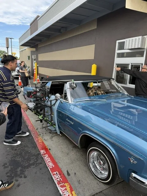 Classic car parked near the mural location.