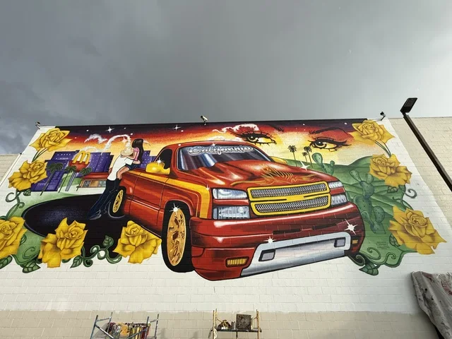 Angled view of the mural wrapping across the building.