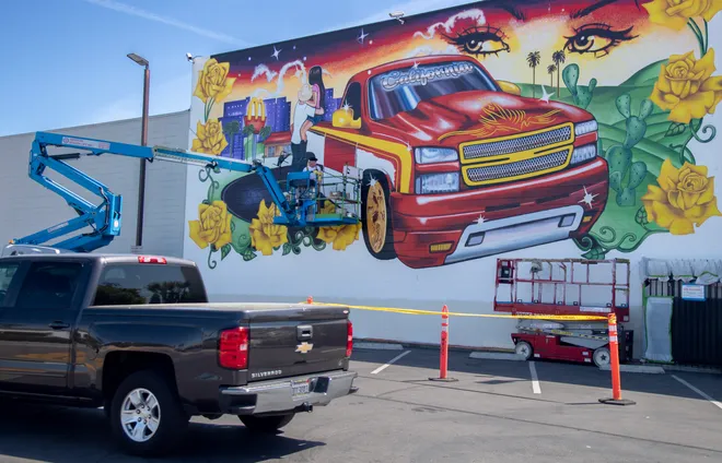 Wide view of the mural from the parking lot.